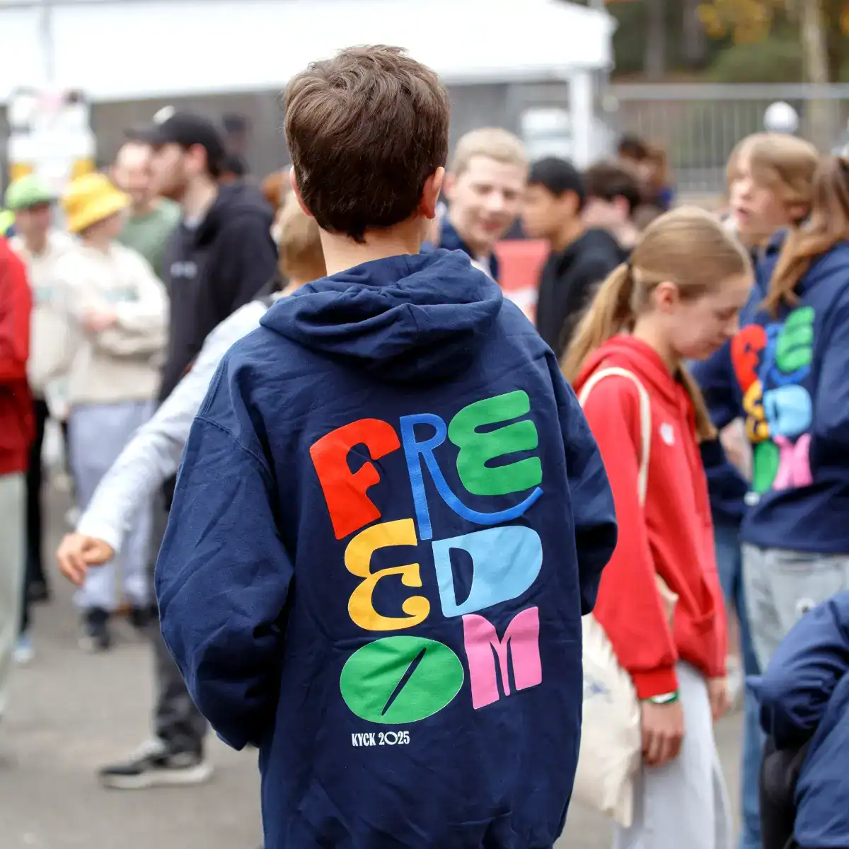 Brightly coloured "FREEDOM" hoodie at KYCK 2026 youth event in Australia, showcasing vibrant student participation and community engagement for youth leadership and faith-based gatherings.