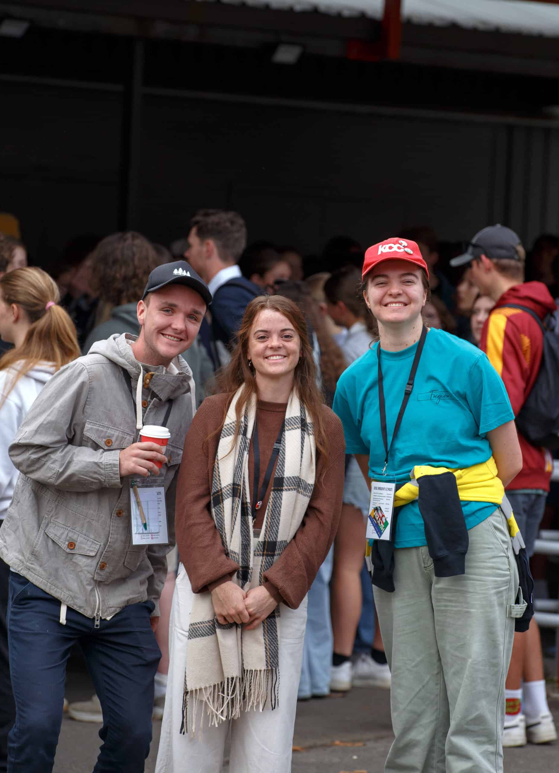 IMG_0264 Young people smiling at KYCK 2026 youth conference in Australia, wearing event badges and casual attire, representing community engagement and youth leadership.