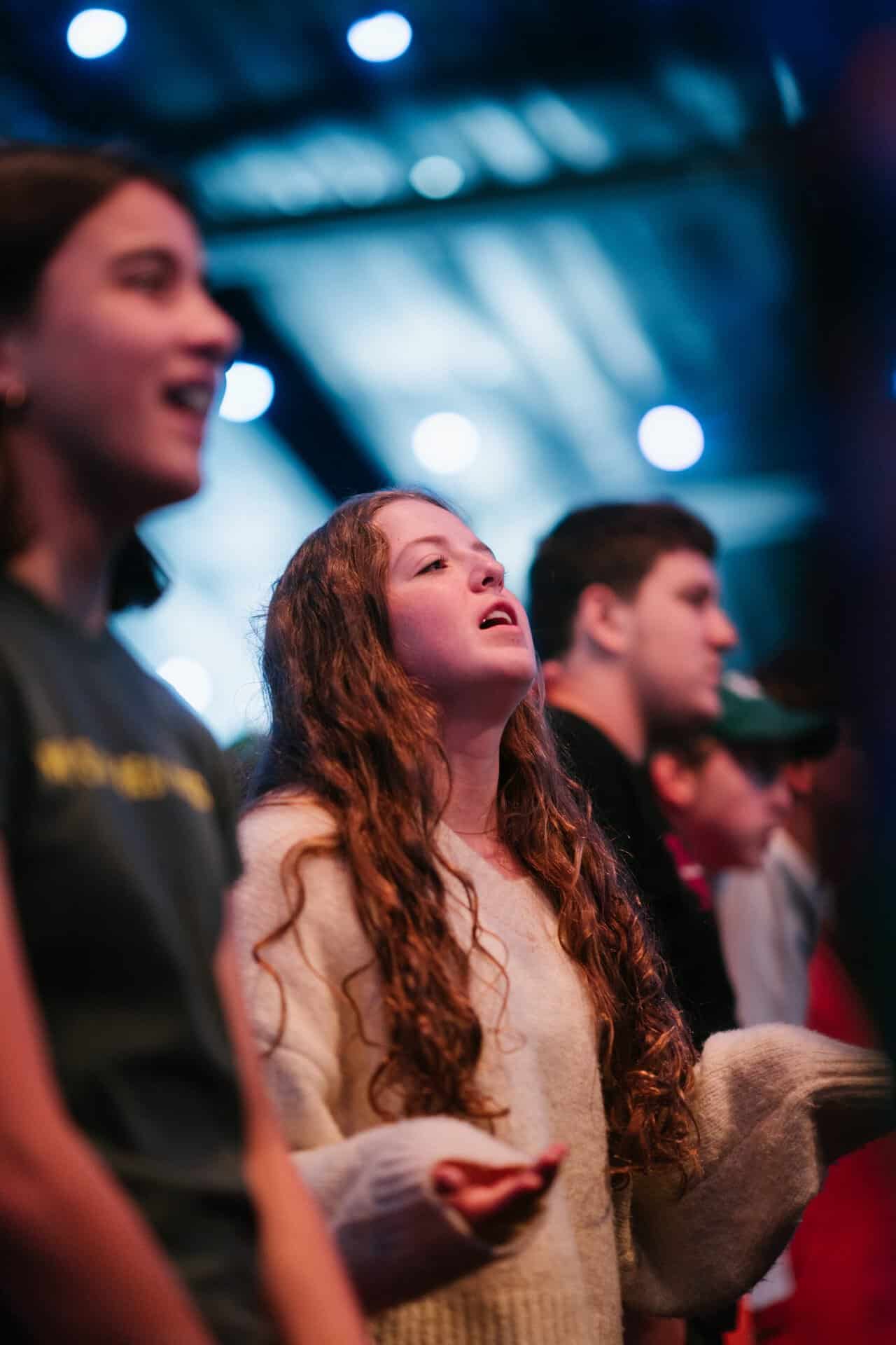 Group of young people attending KYCK 2026 youth conference, engaging in worship and community activities.