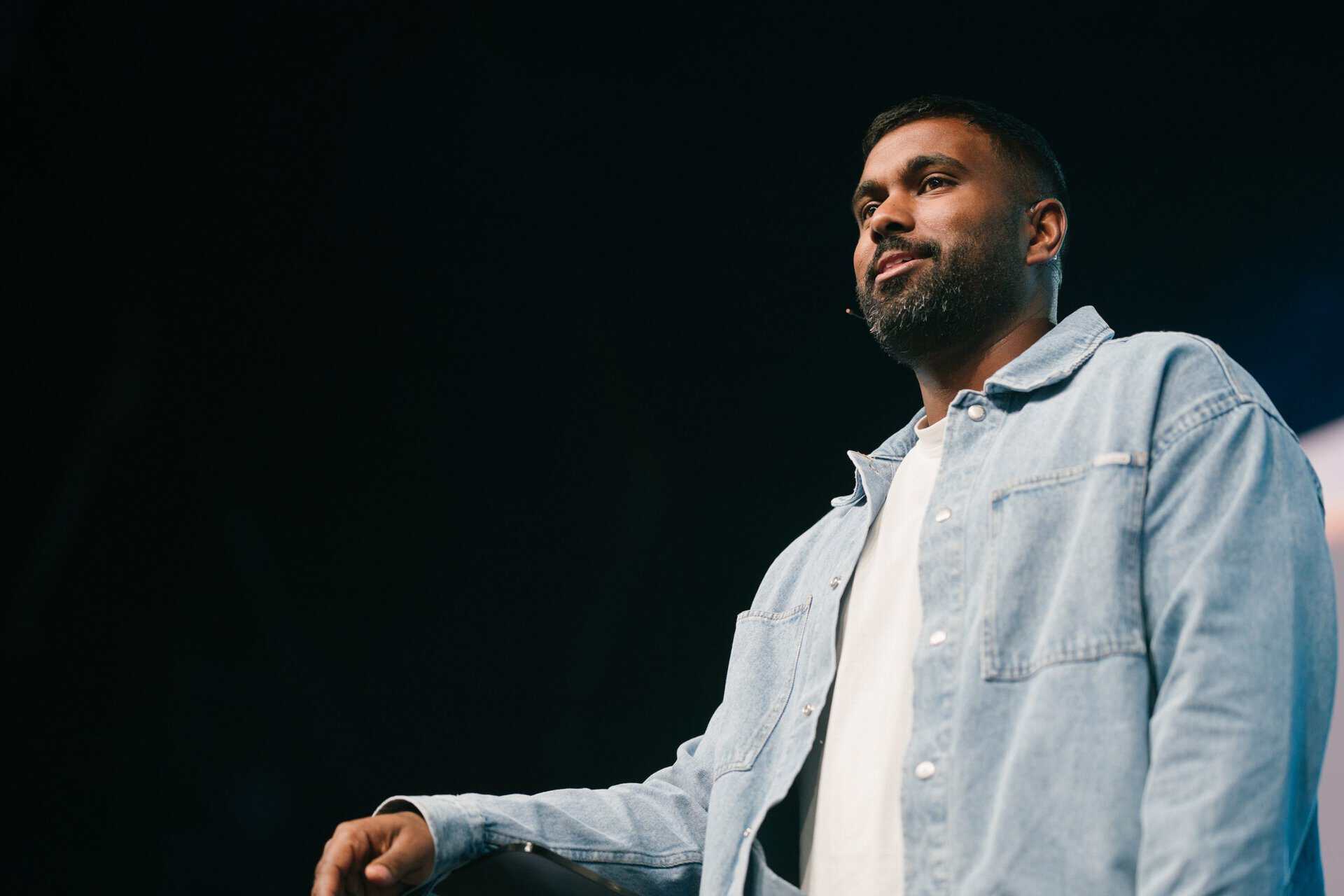 Young man with a beard and casual denim jacket attending KYCK 2026 youth conference, inspiring faith and community engagement.